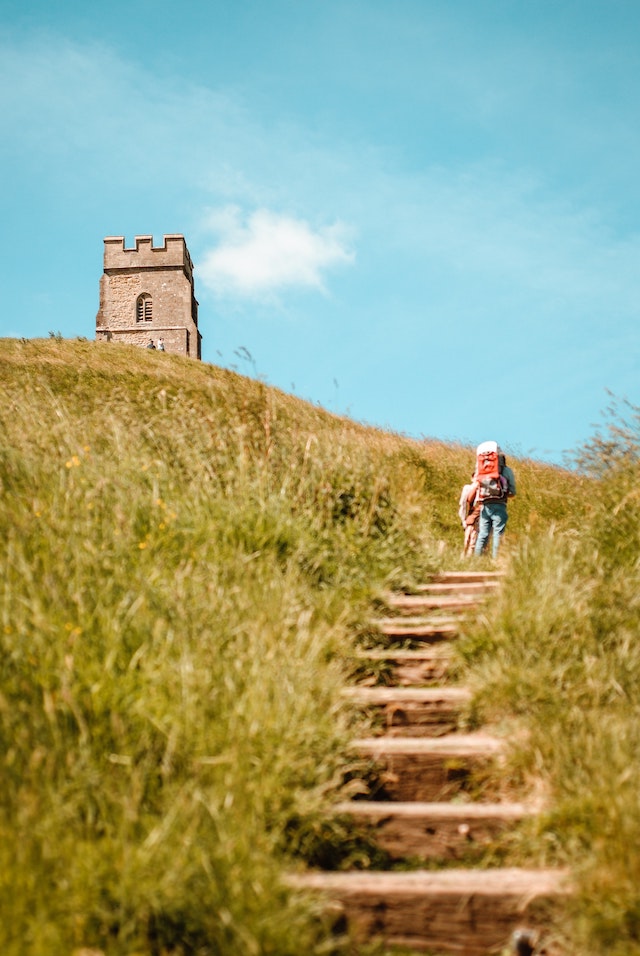 three line tales, week 229: someone trekking up the steps to the tower on top of Glastonbury Tor