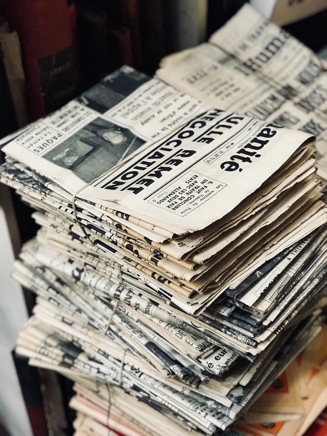 three line tales, week 274: a stack of newspapers